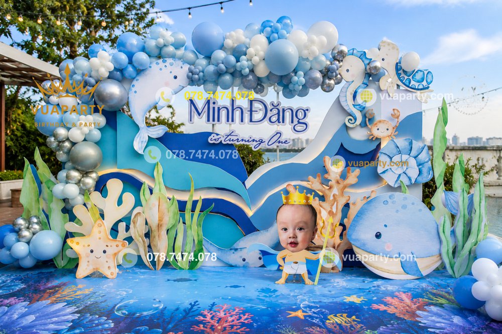 Backdrop trang trí thôi nôi bé trai chủ đề đại dương tone xanh